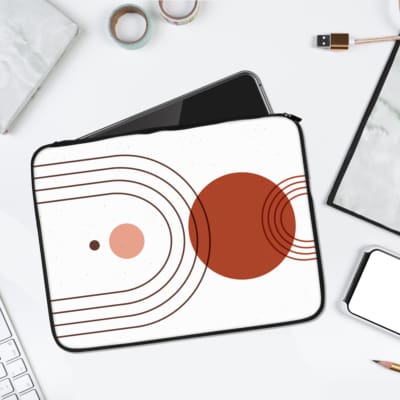 Infidu Minimalist Concentric Circles Laptop Sleeve with red and pink circles design. laptop sleeve kept on a plain white background