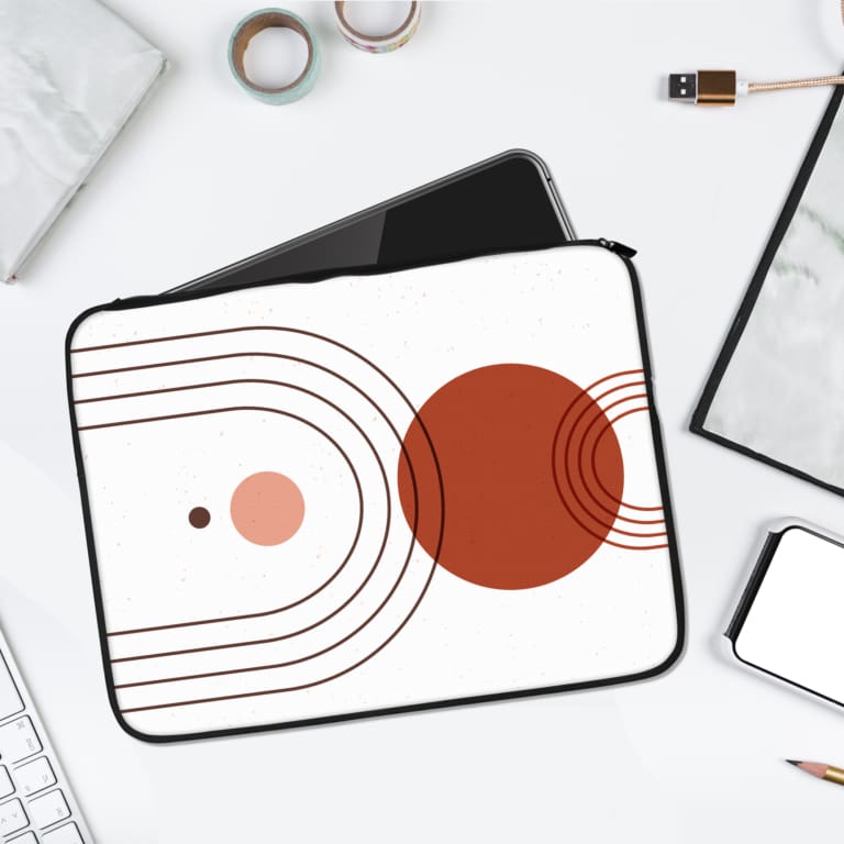 Infidu Minimalist Concentric Circles Laptop Sleeve with red and pink circles design. laptop sleeve kept on a plain white background