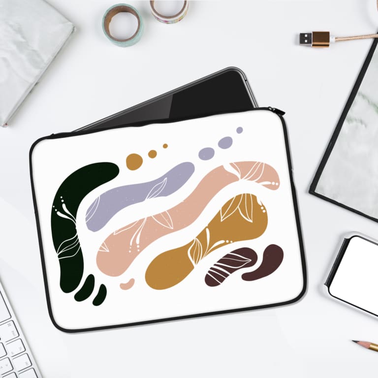 Laptop sleeve with abstract organic shapes in earthy tones of green, beige, lavender, brown, and mustard yellow, with fluid, irregular patterns. laptop sleeve kept on a plain white background