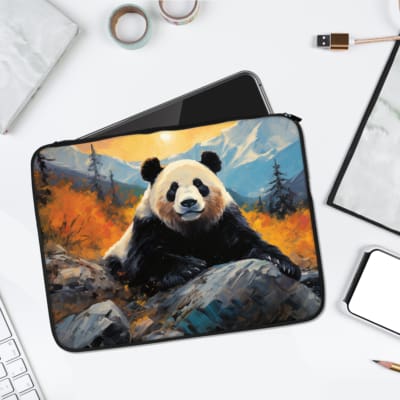 Peaceful panda wildlife laptop sleeve with a panda in an autumn forest, orange and yellow trees, mountains, and a partly cloudy sky. laptop sleeve kept on a plain white background