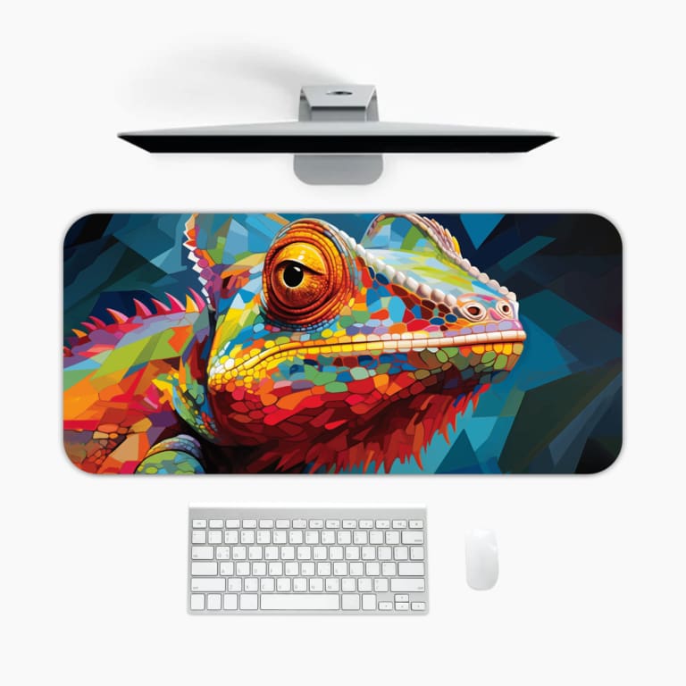 Colorful chameleon on a blue desk mat with vibrant orange, yellow, pink, and blue hues. A desk pad under the computer
