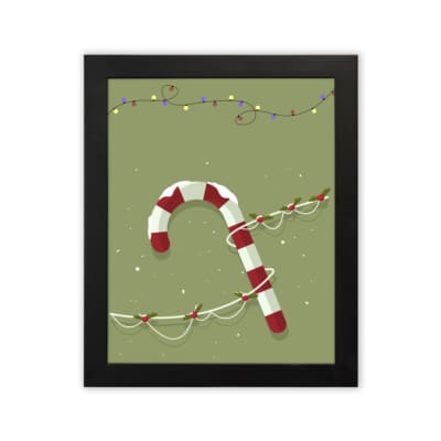 Candy cane with red and white stripes, surrounded by colorful Christmas lights on a light grey or muted green background with a plain white background in a black frame
