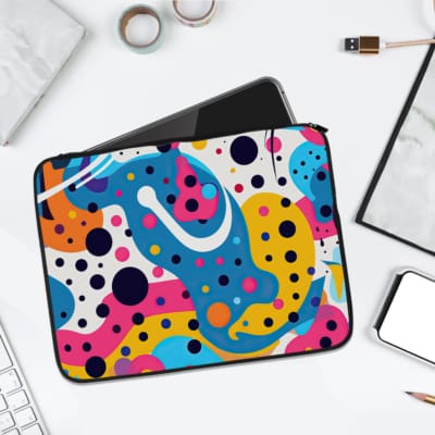 Vibrant abstract multicolored laptop sleeve with blue, yellow, pink, and orange patterns, featuring dots and wavy shapes. laptop sleeve kept on a plain white background