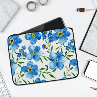 Infidu Floral Blue and Green Elegant Laptop Sleeve with blue flowers and green leaves on a white background. laptop sleeve kept on a plain white background