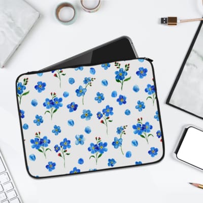 Infidu Blue Floral Pattern Laptop Sleeve with Green Leaves - white background with blue flowers and green leaves. laptop sleeve kept on a plain white background