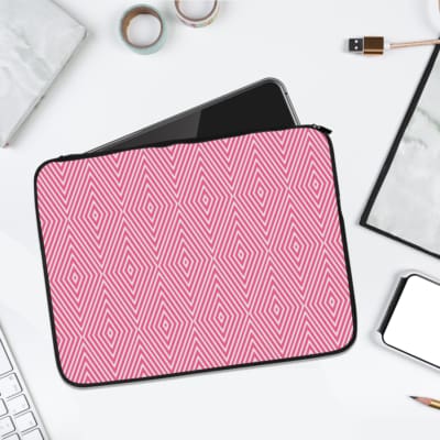 Light Pink laptop sleeve with bold white diamond geometric pattern, stylish and modern design. laptop sleeve kept on a plain white background