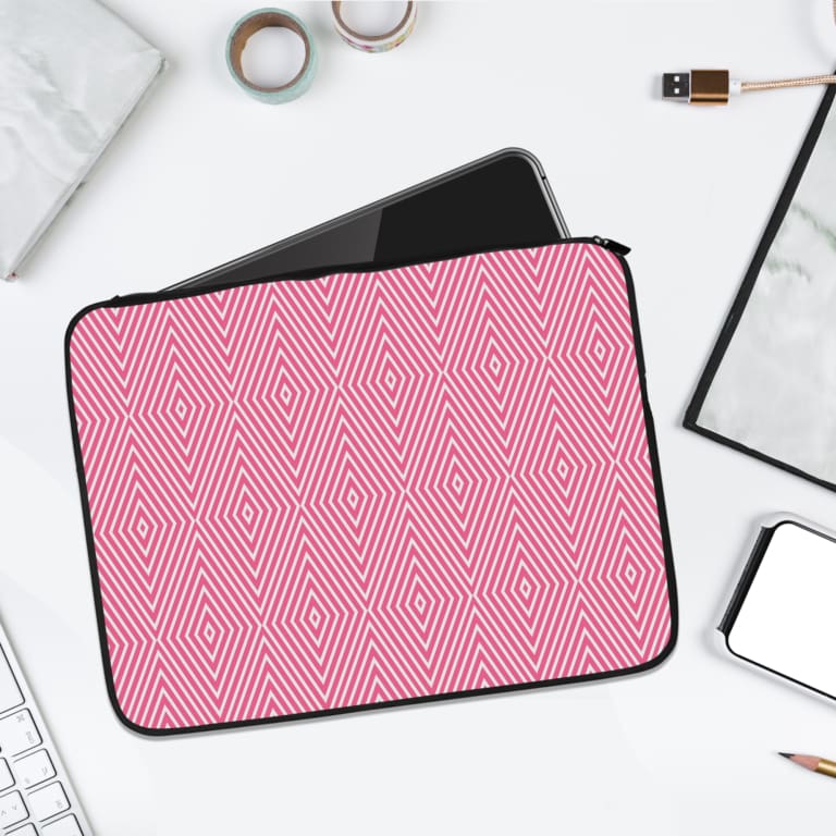 Light Pink laptop sleeve with bold white diamond geometric pattern, stylish and modern design. laptop sleeve kept on a plain white background