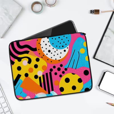 Infidu Vibrant Abstract Laptop Sleeve with bold colorful patterns and geometric shapes. laptop sleeve kept on a plain white background