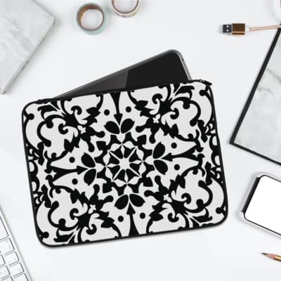 Infidu black and white mandala art laptop sleeve with intricate floral design. laptop sleeve kept on a plain white background