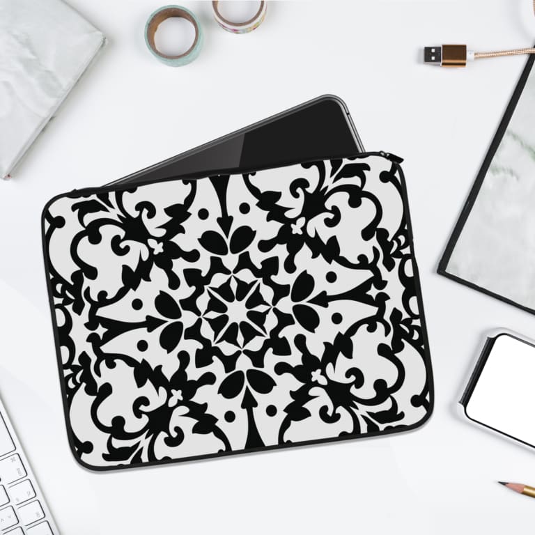 Infidu black and white mandala art laptop sleeve with intricate floral design. laptop sleeve kept on a plain white background