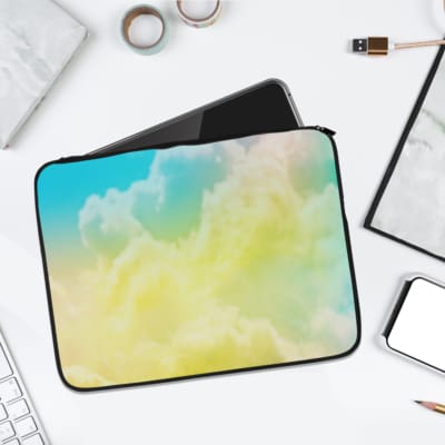 Infidu Dreamy Cloud Gradient Laptop Sleeve featuring soft shades of blue and yellow, resembling a serene sky with fluffy clouds. laptop sleeve kept on a plain white background