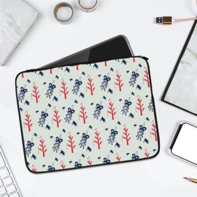 Infidu Red Tree & Blue Ribbon Laptop Sleeve with blue leaves design on a white background. laptop sleeve kept on a plain white background
