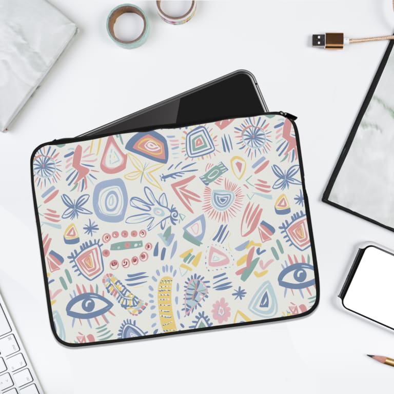 Colorful abstract shapes and patterns laptop sleeve with white background, featuring blue, pink, and orange designs. laptop sleeve kept on a plain white background