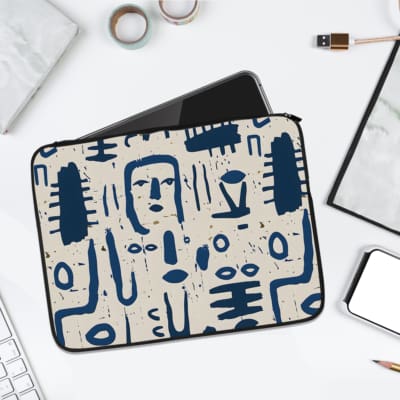 Infidu Tribal Abstract Art Laptop Sleeve with blue tribal designs on a white background. laptop sleeve kept on a plain white background