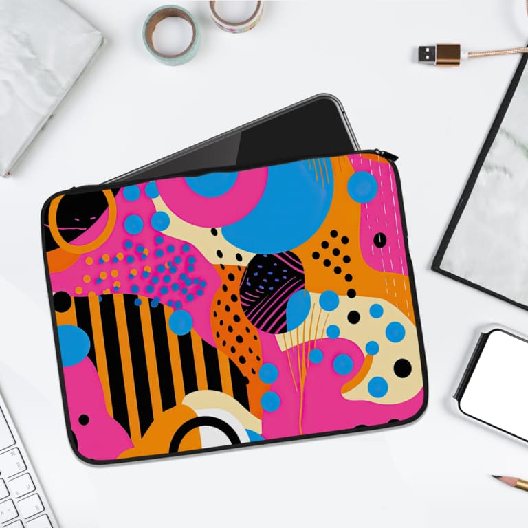 Infidu Vibrant Abstract Laptop Sleeve with bold geometric shapes in purple, yellow, blue, pink, and black. laptop sleeve kept on a plain white background