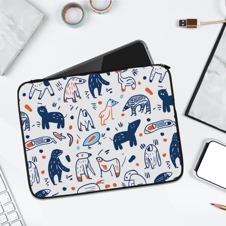 A white laptop sleeve with playful blue, white, and orange animal and abstract design, perfect for protecting and styling your laptop. laptop sleeve kept on a plain white background