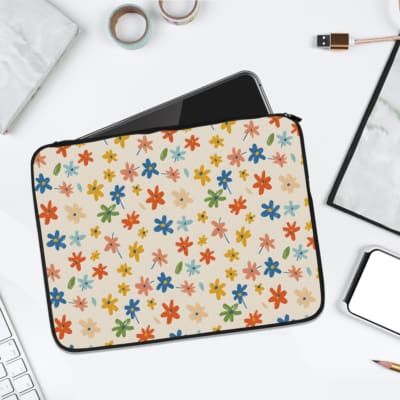 Infidu Vibrant Floral Pattern Laptop Sleeve featuring colorful flowers in orange, blue, green, and yellow on a white background. laptop sleeve kept on a plain white background