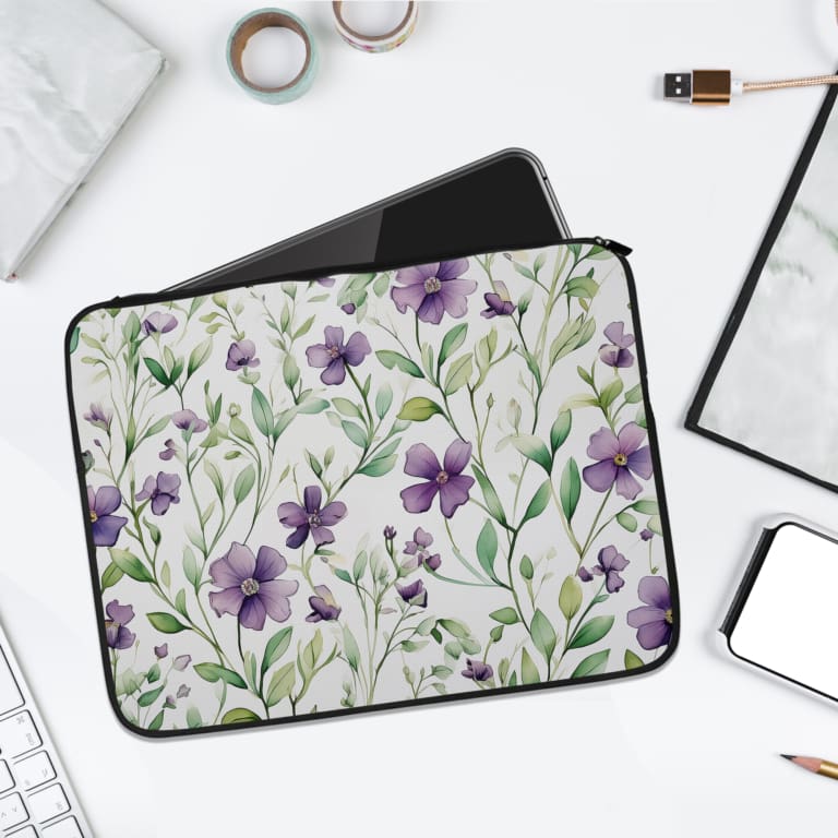 Infidu Floral Purple & Green Design Laptop Sleeve with vibrant flowers on a white background, perfect for protecting your laptop. laptop sleeve kept on a plain white background