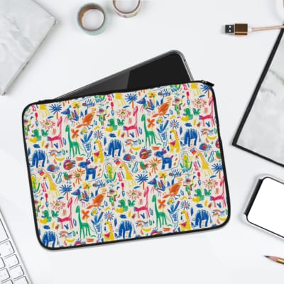Infidu Colorful Animal Illustration Laptop Sleeve with vibrant animal designs on a white background. laptop sleeve kept on a plain white background
