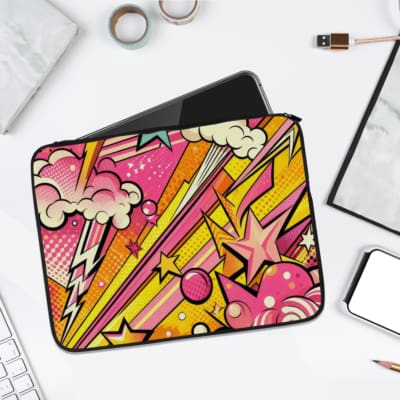 Vibrant comic-style laptop sleeve with bright pink, yellow, and purple colors, decorated with stars, clouds, lightning bolts, and dotted patterns. laptop sleeve kept on a plain white background