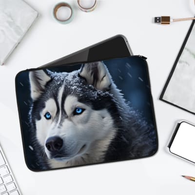 Husky with blue eyes on a snowy winter background laptop sleeve, designed for protection and style. laptop sleeve kept on a plain white background