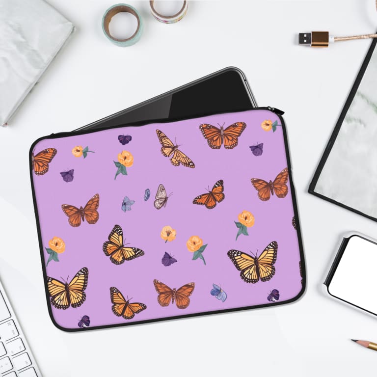 Infidu Purple Butterfly Floral Design Laptop Sleeve with butterflies and floral patterns on a purple background. laptop sleeve kept on a plain white background