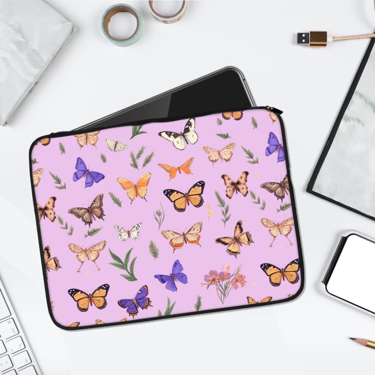 Infidu Nature-Inspired Purple Butterfly Laptop Sleeve with butterflies and floral elements on a light purple background. laptop sleeve kept on a plain white background