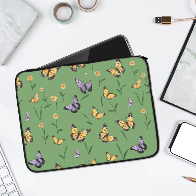 Infidu Nature-Inspired Green Butterfly Laptop Sleeve with colorful butterflies and floral elements on a green background. laptop sleeve kept on a plain white background