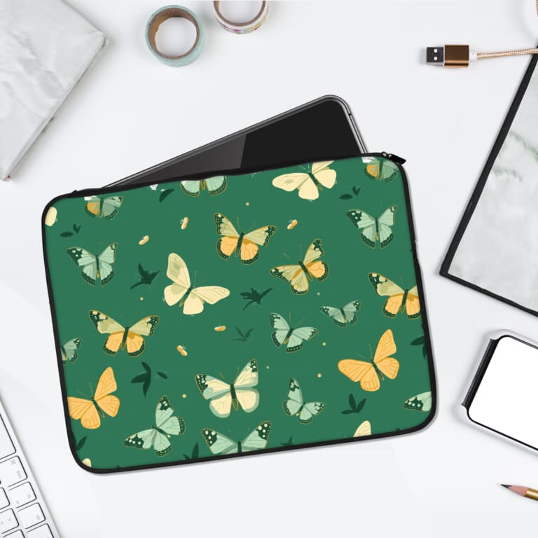 Green laptop sleeve with minimalist butterfly design in shades of white, yellow, and light green on a soft green background. laptop sleeve kept on a plain white background