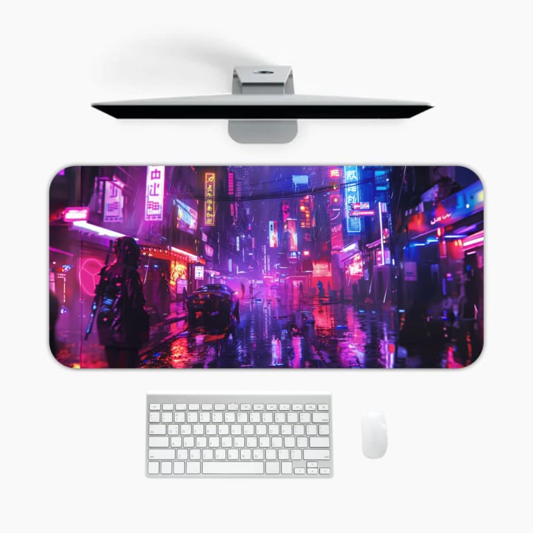 Infidu Neon Cityscape Desk Pad showcases a dark background with vibrant pink, purple, and blue neon lights reflecting on wet streets. A desk pad under the computer