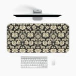 Infidu Floral Desk Pad featuring intricate white flowers on a black background, showcasing a stylish and elegant design. A desk pad under the computer