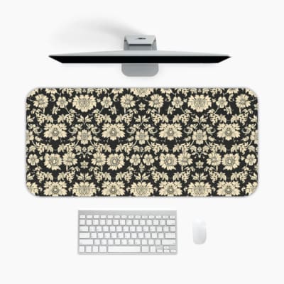 Infidu Floral Desk Pad featuring intricate white flowers on a black background, showcasing a stylish and elegant design. A desk pad under the computer