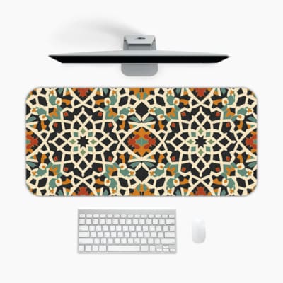 Infidu Geometric Desk Pad with colorful mosaic design in black, blue, orange, yellow on white background for a vibrant workspace. A desk pad under the computer
