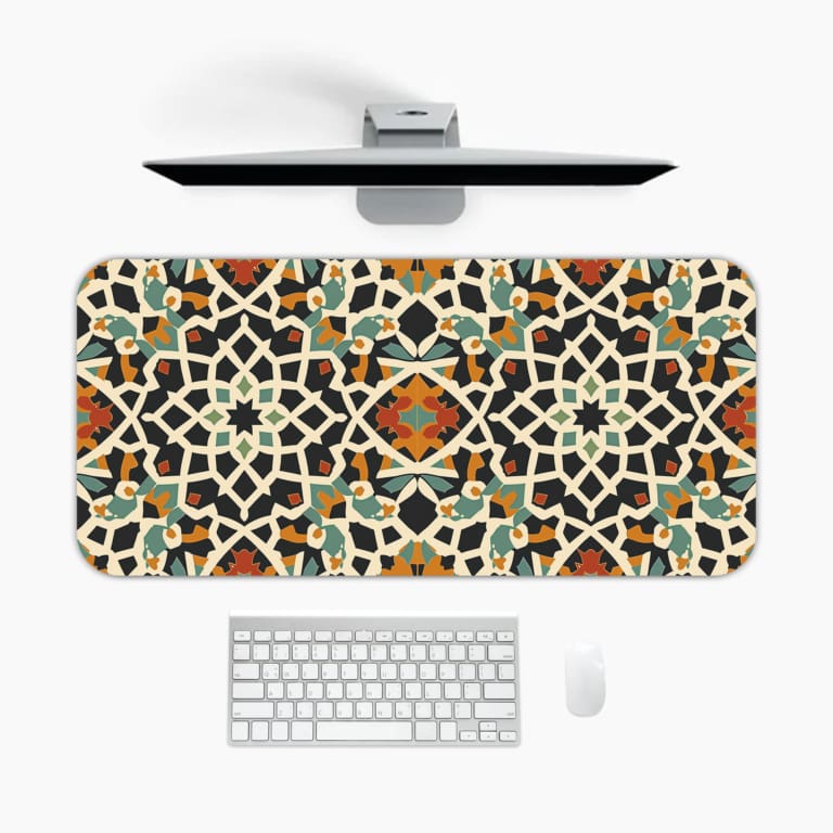 Infidu Geometric Desk Pad with colorful mosaic design in black, blue, orange, yellow on white background for a vibrant workspace. A desk pad under the computer