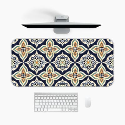 Infidu desk pad featuring a symmetrical floral design in soft peach, beige, and white tones on a dark blue background. A desk pad under the computer