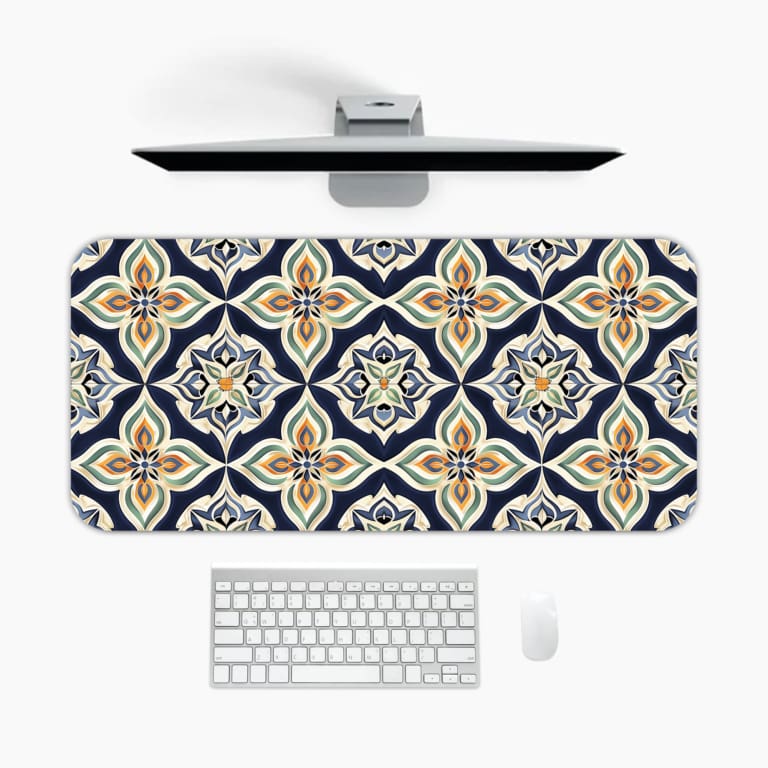 Infidu desk pad featuring a symmetrical floral design in soft peach, beige, and white tones on a dark blue background. A desk pad under the computer
