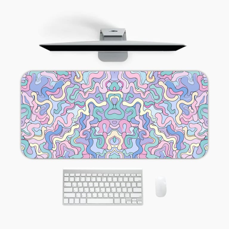 Infidu Colorful Abstract Desk Pad showcasing playful wavy designs in pastel colors on a light background. A desk pad under the computer