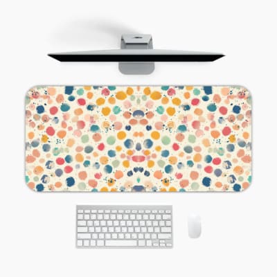 Infidu desk pad with terrazzo pattern, featuring multicolored speckles on a light background for a playful, modern touch. A desk pad under the computer