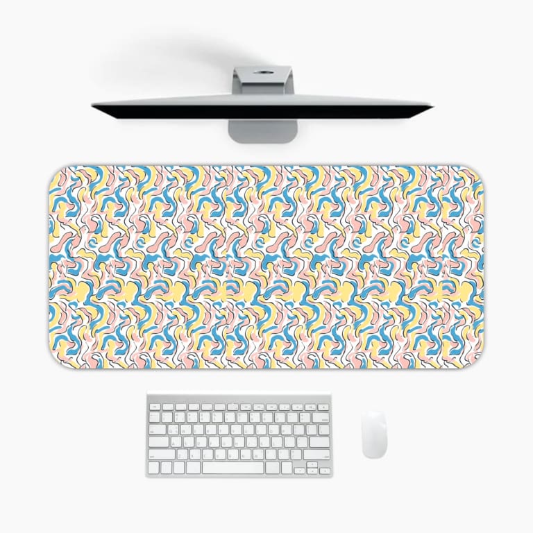 Infidu Wavy Desk Pad showcases colorful curved lines in shades of blue, yellow, and green against a light background. A desk pad under the computer