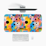 Infidu vibrant geometric desk pad with colorful abstract shapes and yellow background A desk pad under the computer