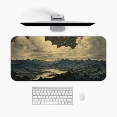 Infidu Nature Desk Pad with a serene mountain and river design, featuring muted grays and blues against a dramatic cloudy sky. A desk pad under the computer