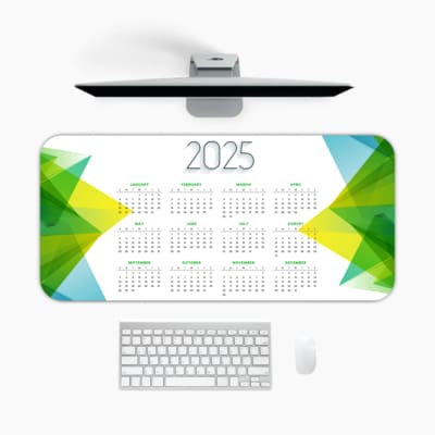Infidu 2025 Desk Mat Calendar with modern colorful geometric patterns on a white background. A desk pad under the computer
