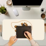 Infidu Cartoon Dog Desk Pad featuring a happy dog in yellow and brown on a white background, adding a playful touch to your desk. A writing pad on top of the desk pad