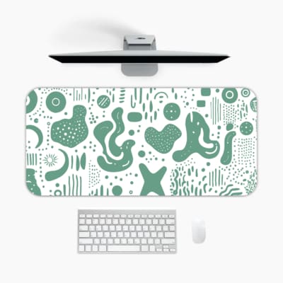 Infidu desk pad with green abstract shapes on white background, inspired by vintage art.