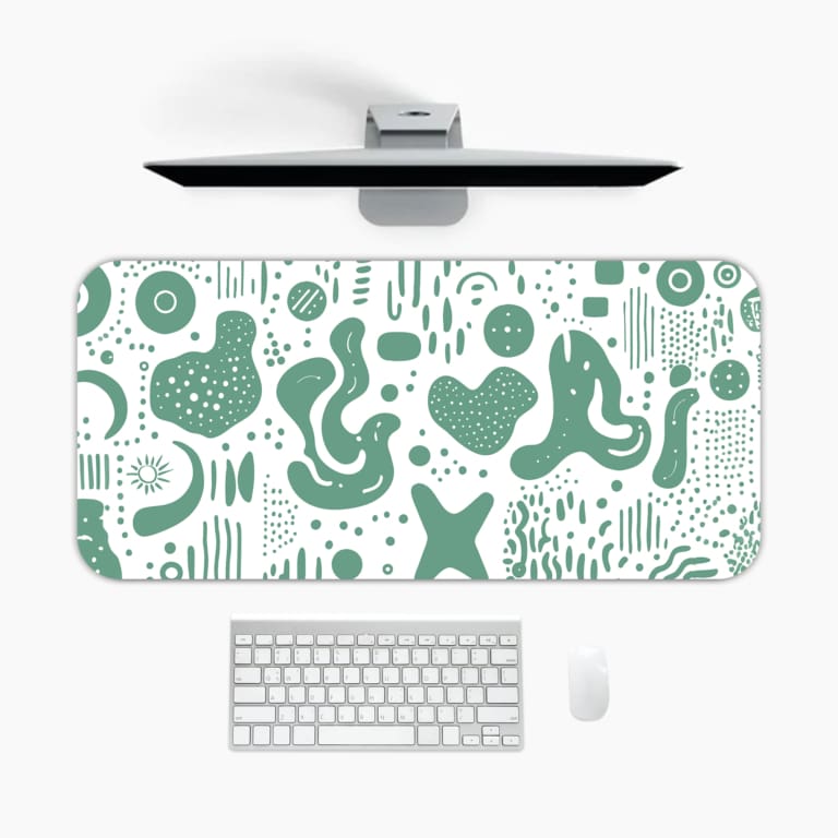 Infidu desk pad with green abstract shapes on white background, inspired by vintage art.