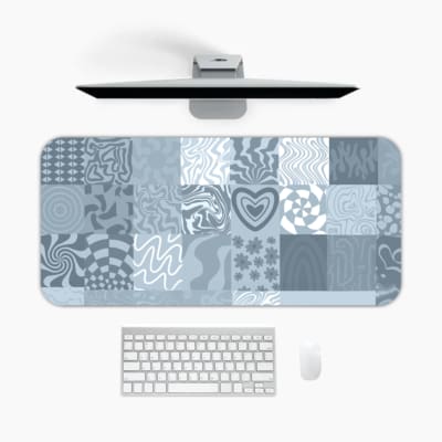 Infidu abstract mosaic desk pad with blue and grey artistic patchwork designs.