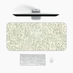 Infidu desk pad with light green abstract doodle design on cream background, featuring playful shapes, lines, and artistic elements.