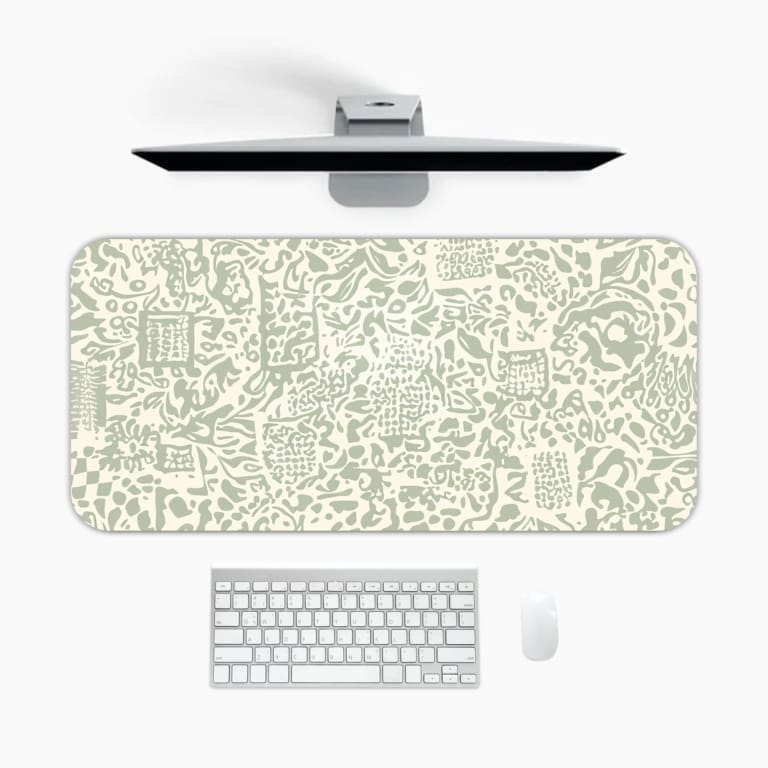 Infidu desk pad with light green abstract doodle design on cream background, featuring playful shapes, lines, and artistic elements.