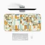 Infidu desk pad with mustard and teal geometric blocks in a modern vintage art style.