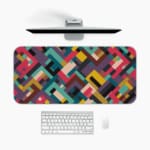 Infidu colorful geometric desk pad with bold blocks in red, teal, mustard, and maroon on a white background.